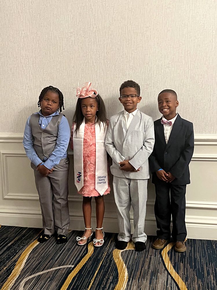Young children dressed for a formal chapter event