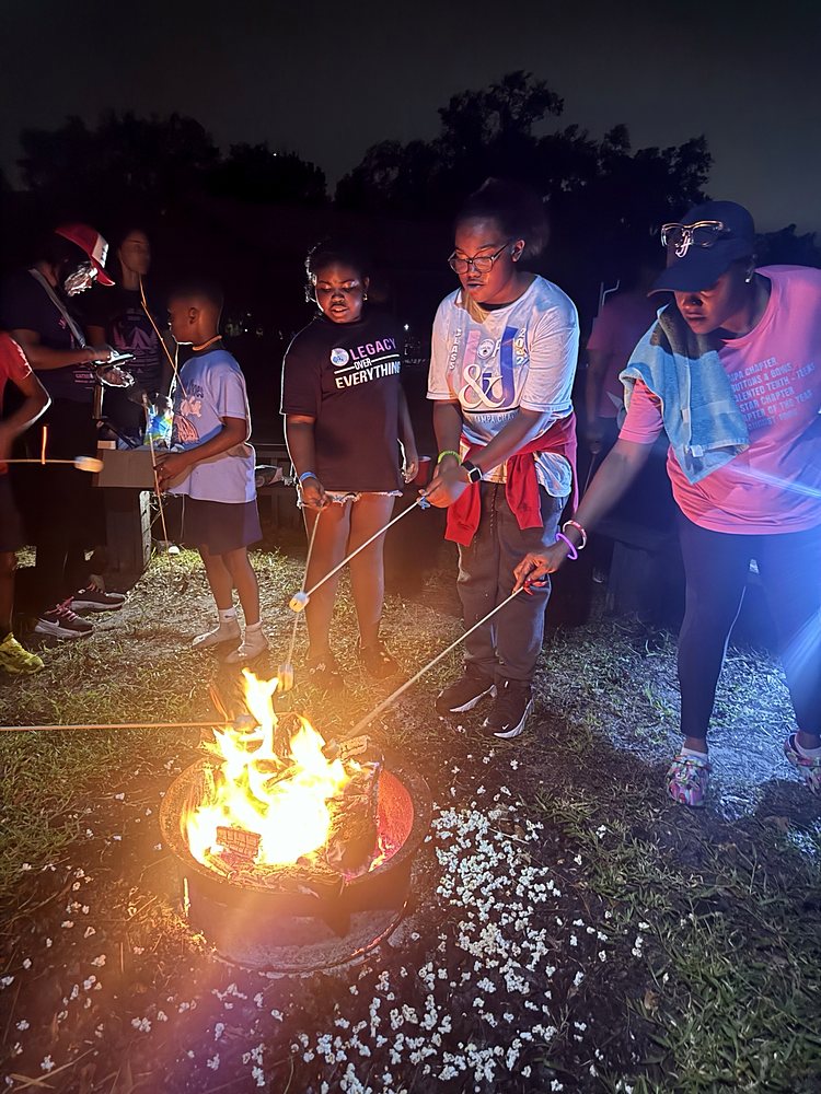 Children roasting marshmallows at a campfire