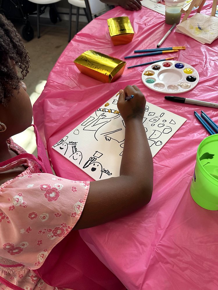 A child painting at an art activity
