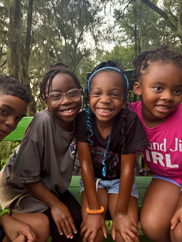 Children smiling together at camp