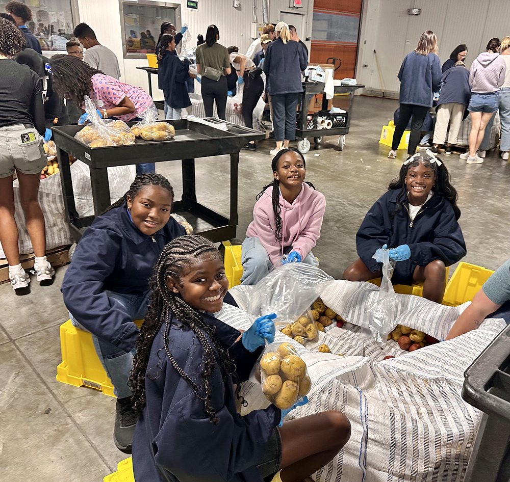 Children packing food at a community food bank